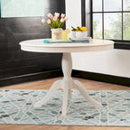 Table ronde à pied central en bois massif