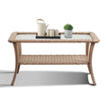 Table basse d'extérieur en osier avec plateau en verre