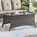 Table basse d'extérieur en osier avec plateau en verre et rotin
