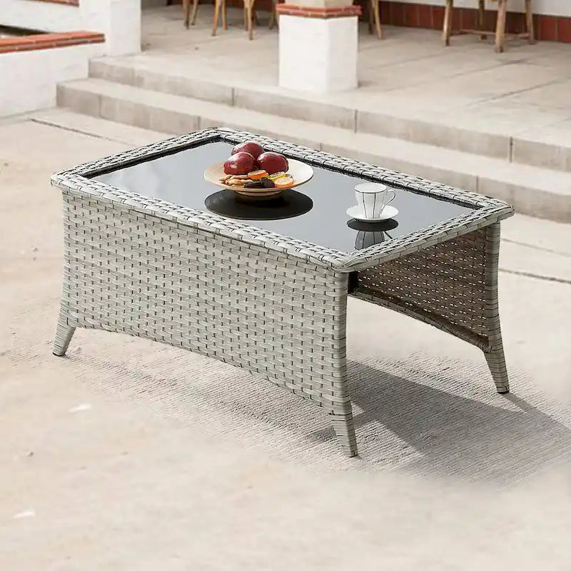 Table basse d'extérieur en osier avec plateau en verre et rotin