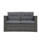 Causeuse d'extérieur en osier avec coussin