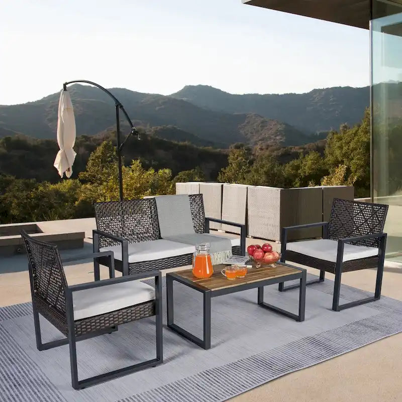 Ensemble de conversation d'extérieur 4 pièces en osier avec plateau de table en bois d'acacia et coussins